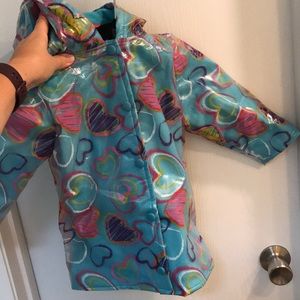 Warm fleece lined wipeable rain coat.  EUC size 2T